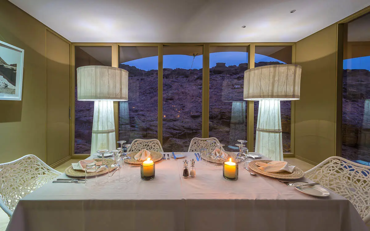 Fine dining table set for two with desert views, Hoanib Skeleton Coast Camp, Skeleton Coast, Namibia
