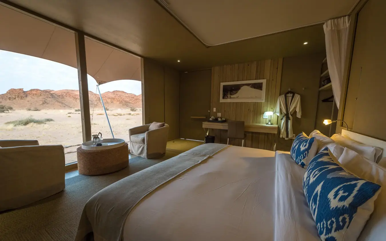 Luxury tent bedroom with panoramic desert landscape views, Hoanib Skeleton Coast Camp, Skeleton Coast, Namibia