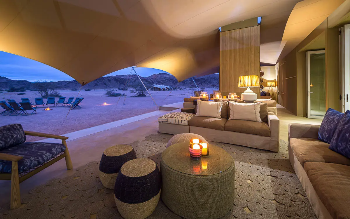 Open-air lounge with desert views at twilight, Hoanib Skeleton Coast Camp, Skeleton Coast, Namibia