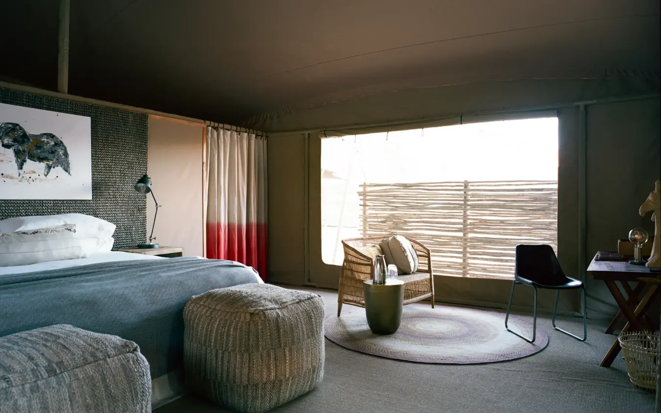 Spacious safari bedroom with canvas walls and outdoor views, Hoanib Valley Camp, Skeleton Coast, Namibia
