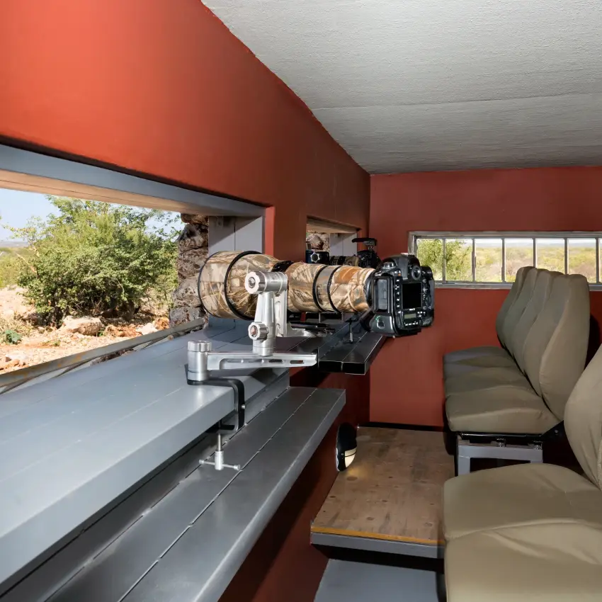 Safari observation room with telescope overlooking arid bushland, Horizon by Ongava, Etosha National Park, Namibia