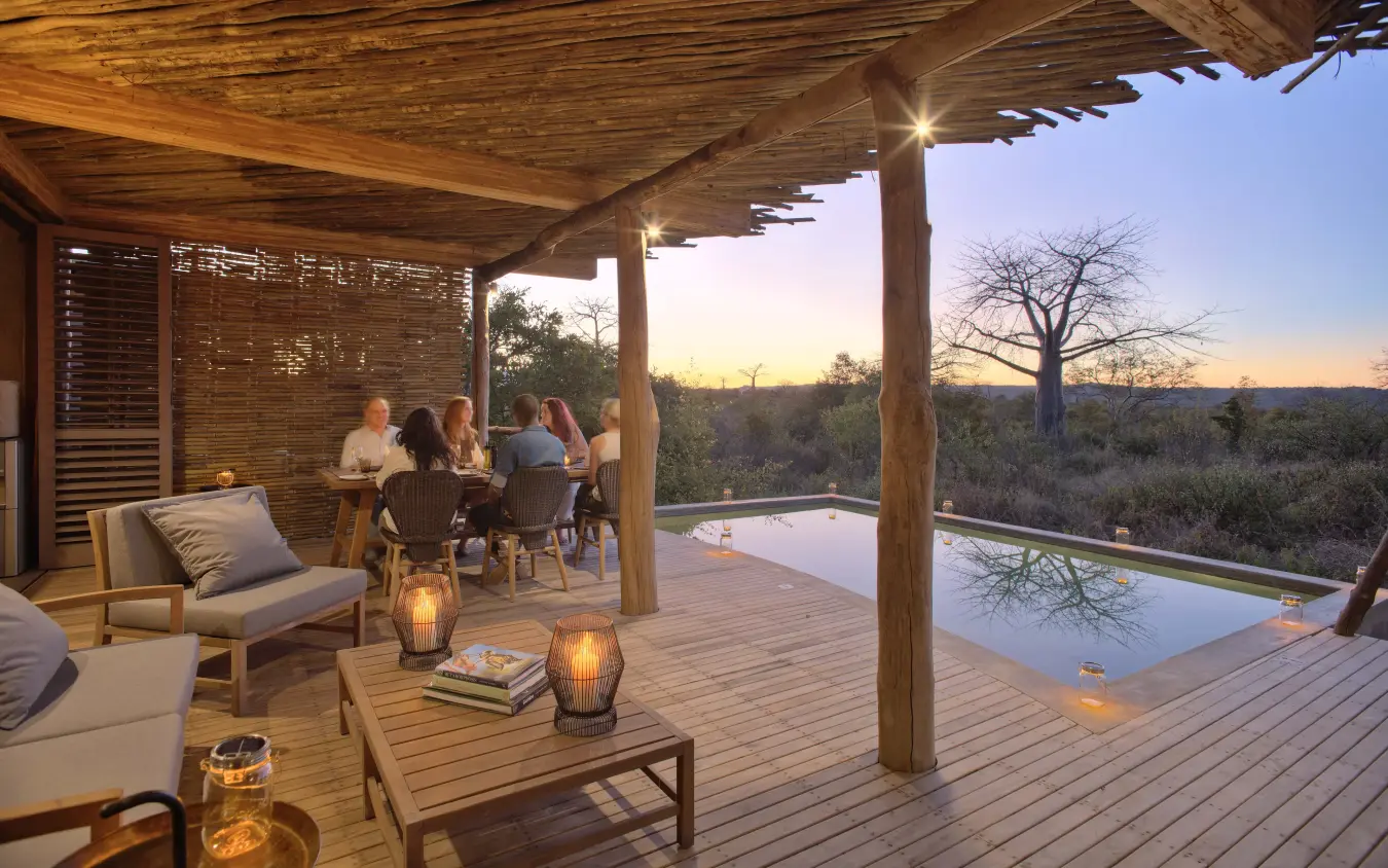 Wooden deck with lounge seating overlooking savanna at dusk, Jabali Private House, Ruaha National Park, Tanzania