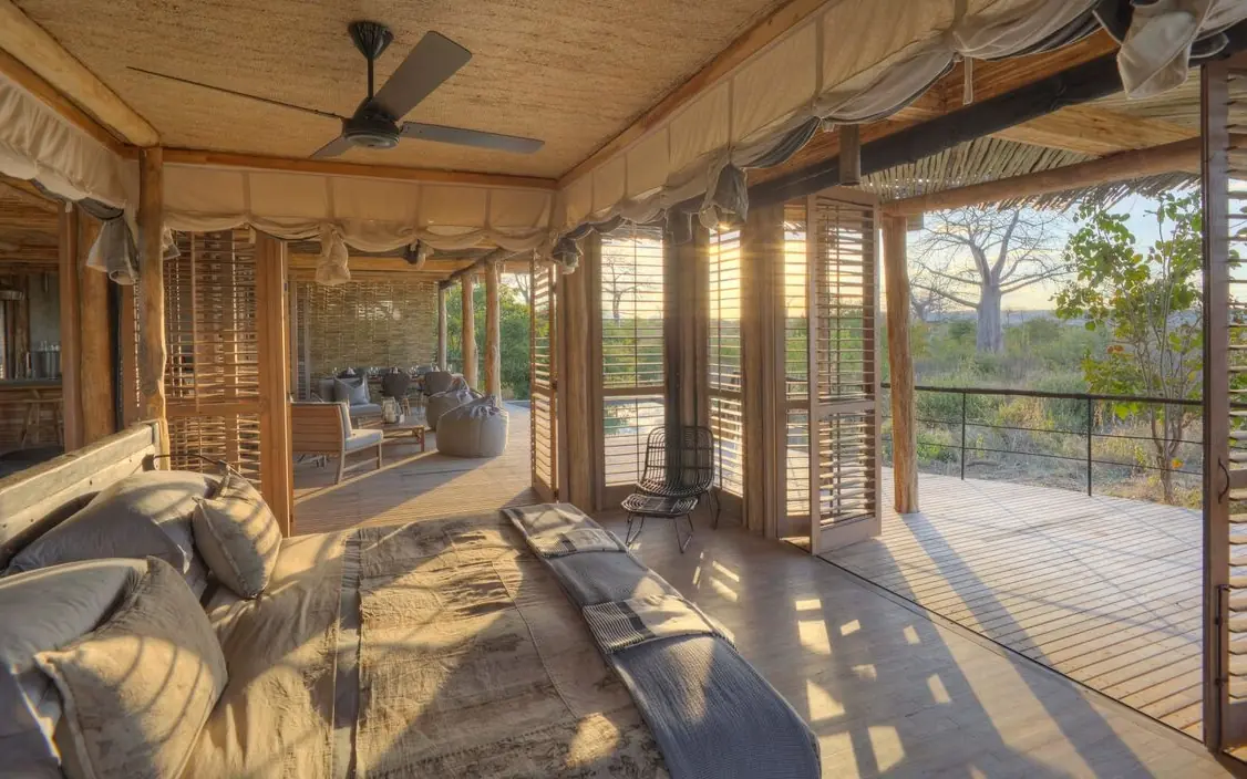 Open-air deck with lounge seating overlooking savanna landscape, Jabali Private House, Ruaha National Park, Tanzania