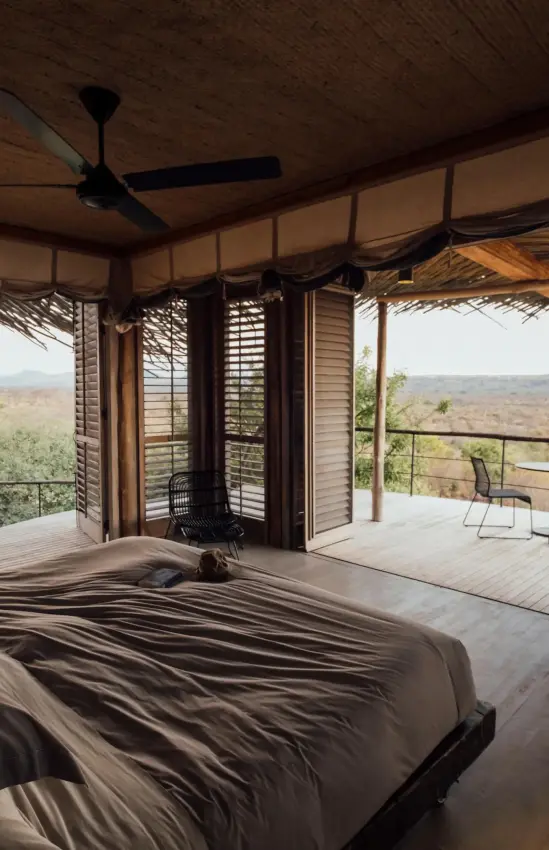 Bedroom with expansive views of savanna landscape, Jabali Ridge, Ruaha National Park, Tanzania