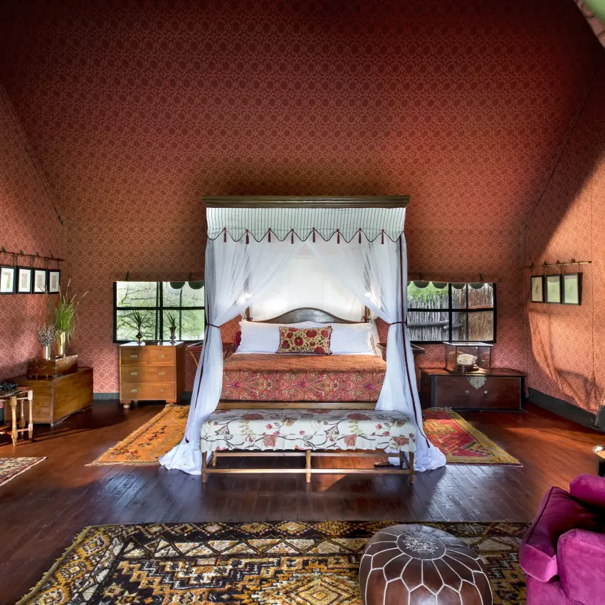 Luxury tent bedroom with four-poster canopy bed and furnishings, Jack’s Camp, Makgadikgadi Pans, Botswana