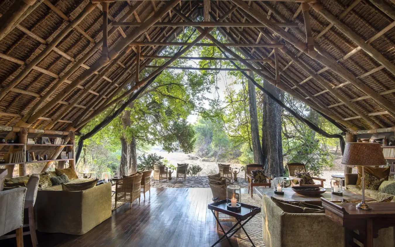 Open-air lounge with wooden beams and natural light, Jongomero Camp, Ruaha National Park, Tanzania