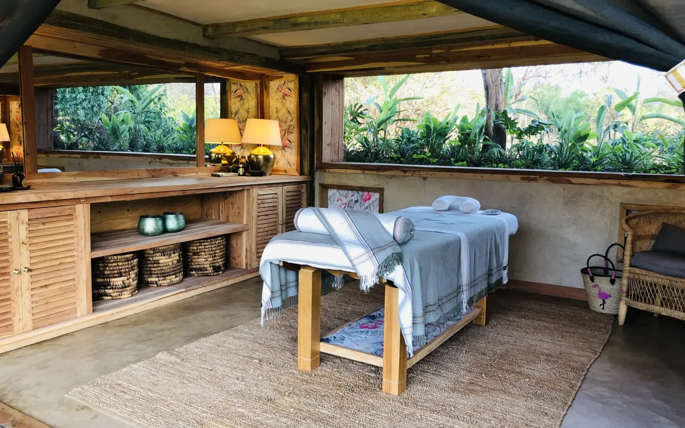 Spa treatment room with massage table and garden views, Kalepo Camp, Northern Kenya, Kenya