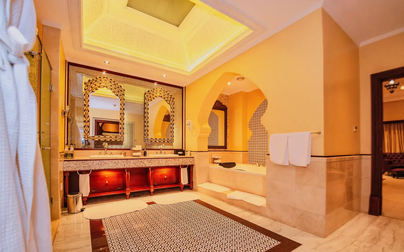 Luxurious spa bathroom with dual vanities and Moroccan-style arched alcove, Kampala Serena Hotel, Entebbe and Kampala, Uganda