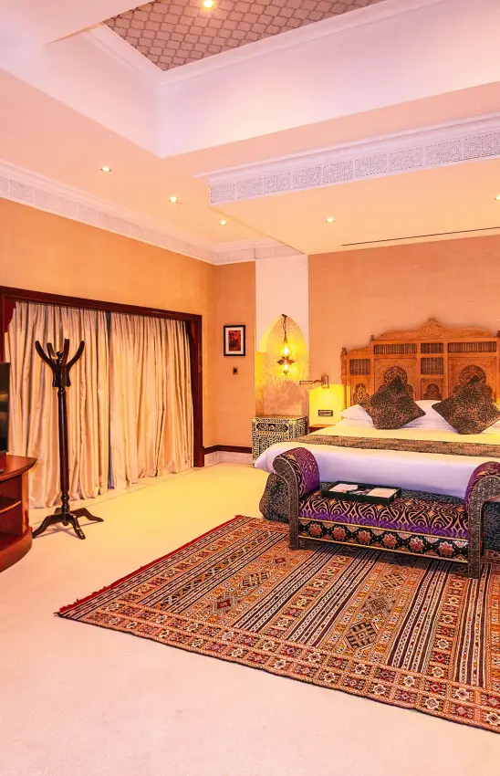 Luxury bedroom suite with ornate furnishings and warm amber lighting, Kampala Serena Hotel, Entebbe and Kampala, Uganda
