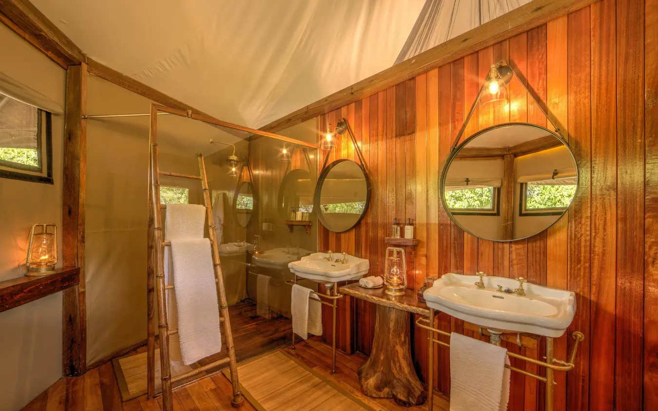 Luxury bathroom with wooden walls and twin sinks, Kanana, The Okavango Delta, Botswana