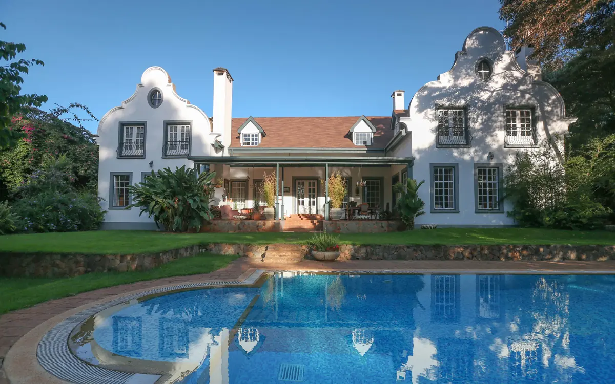 White colonial manor with swimming pool and manicured grounds, Karen Gables, Nairobi, Kenya
