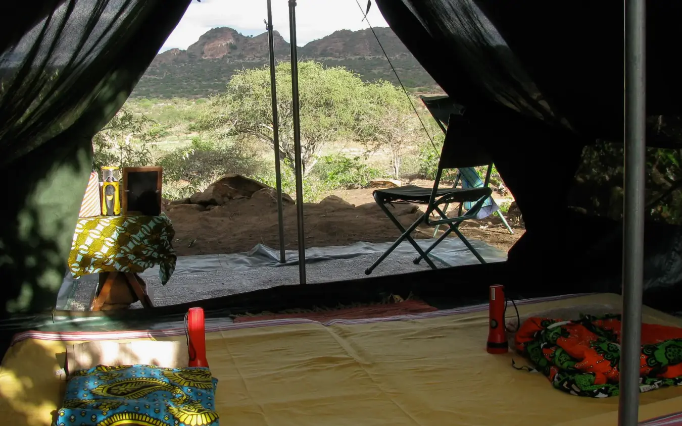 Interior view of safari tent with mountain landscape, Karisia Walking Safaris, Laikipia Highlands, Kenya
