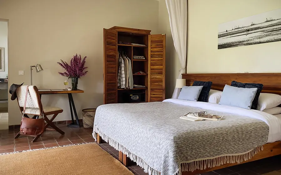 Spacious bedroom with wooden bed frame and wardrobe, Katambuga House, Arusha, Tanzania
