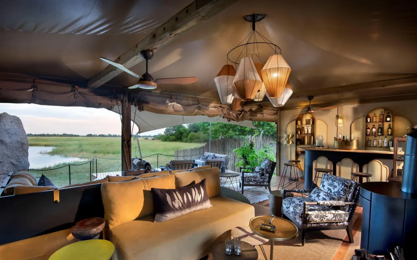 Open-air lounge with views over wetland landscape, Khwai Leadwood, The Okavango Delta, Botswana