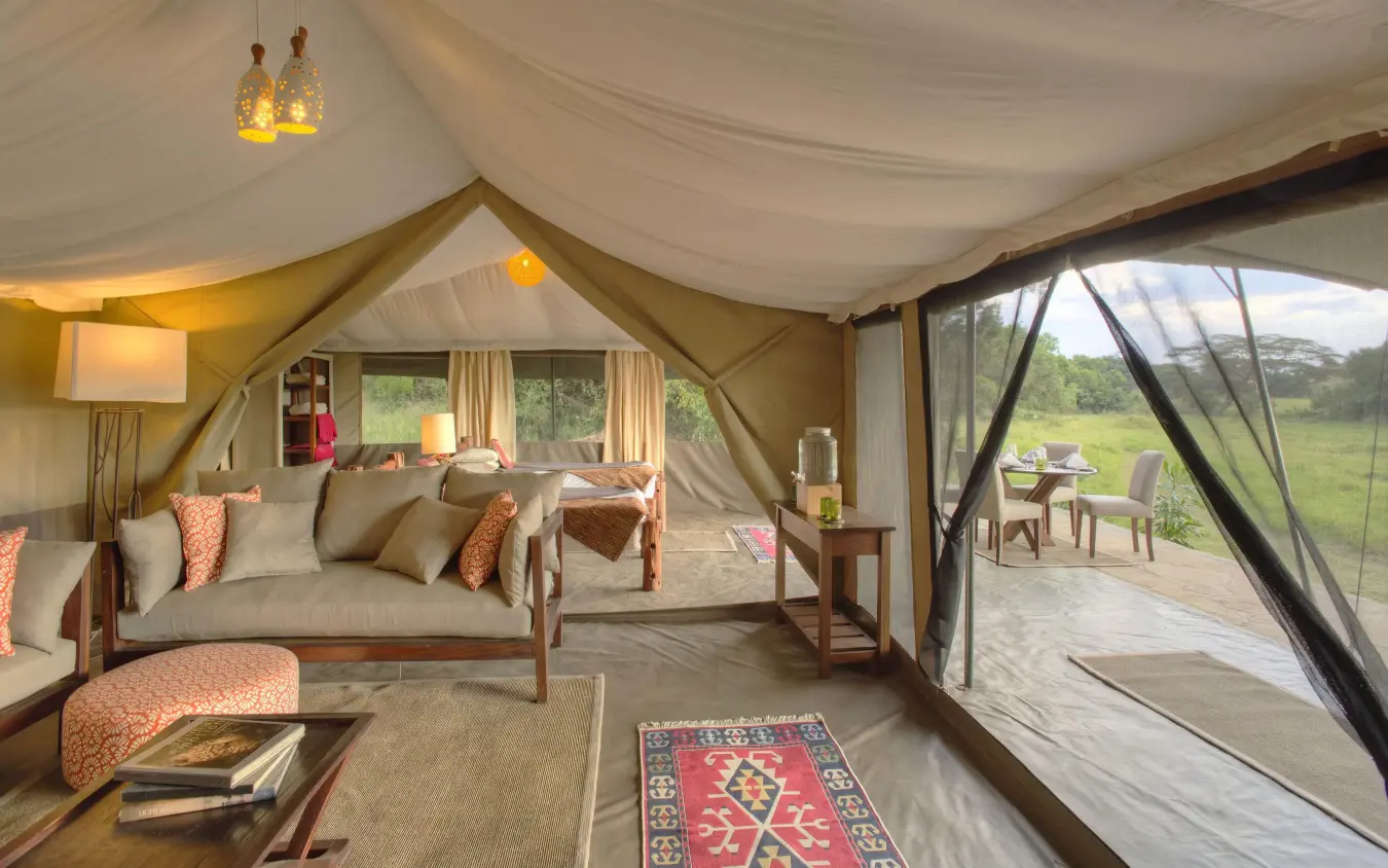 Spacious safari tent interior with canvas furnishings and savanna views, Kicheche Mara North, Maasai Mara, Kenya