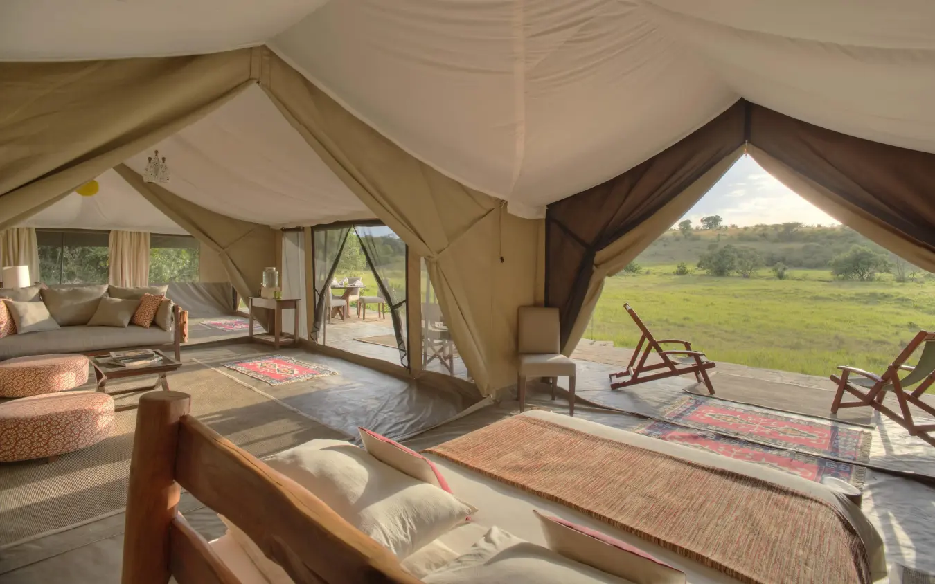 Luxury safari tent bedroom with savanna view, Kicheche Mara North, Maasai Mara, Kenya