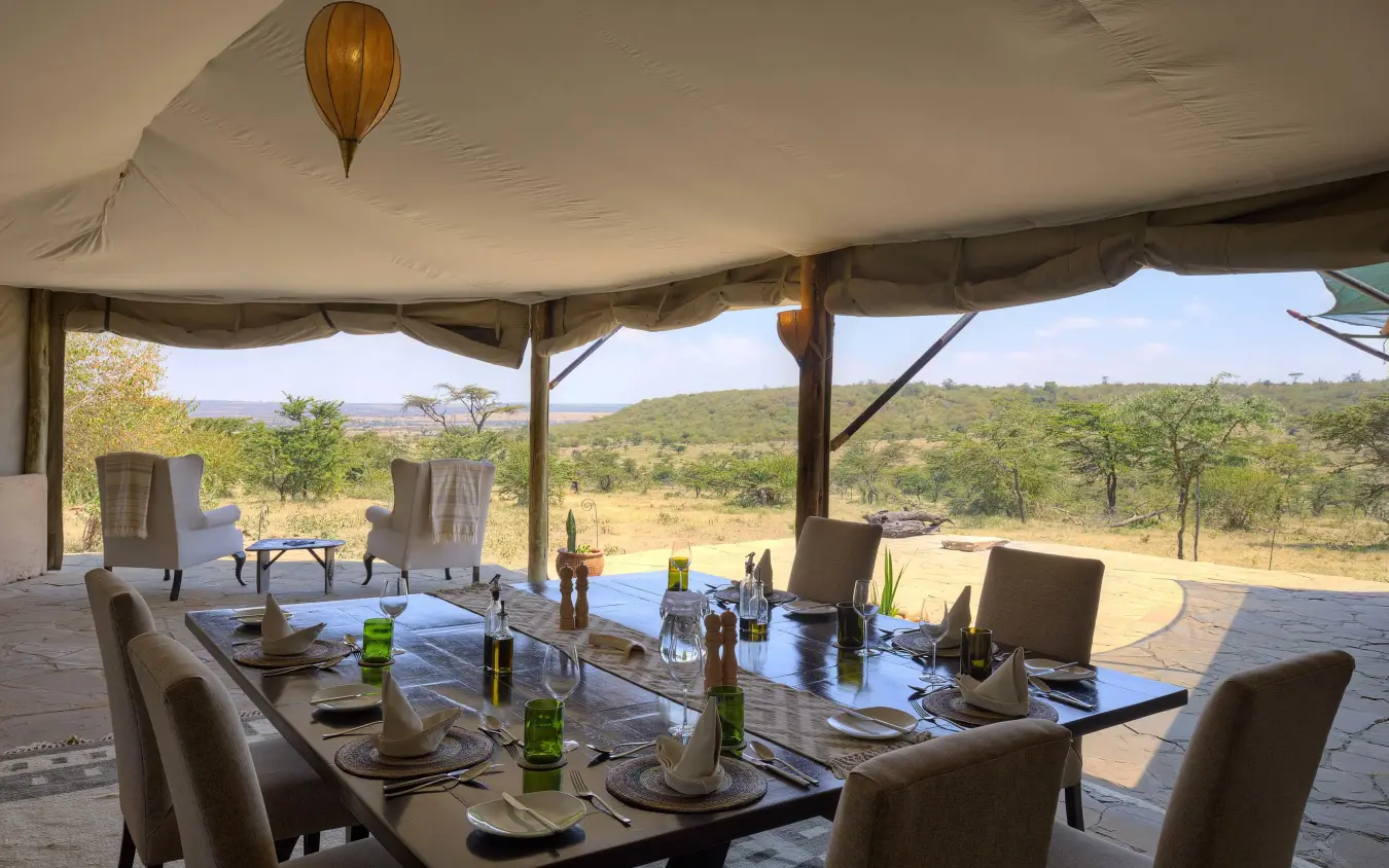 Dining setup under canvas with savanna views, Kicheche Valley Naboisho, Maasai Mara, Kenya
