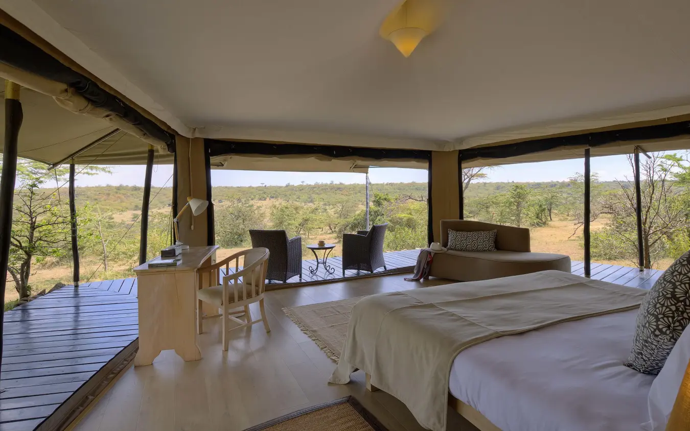 Spacious bedroom with panoramic windows overlooking savanna landscape, Kicheche Valley Naboisho, Maasai Mara, Kenya