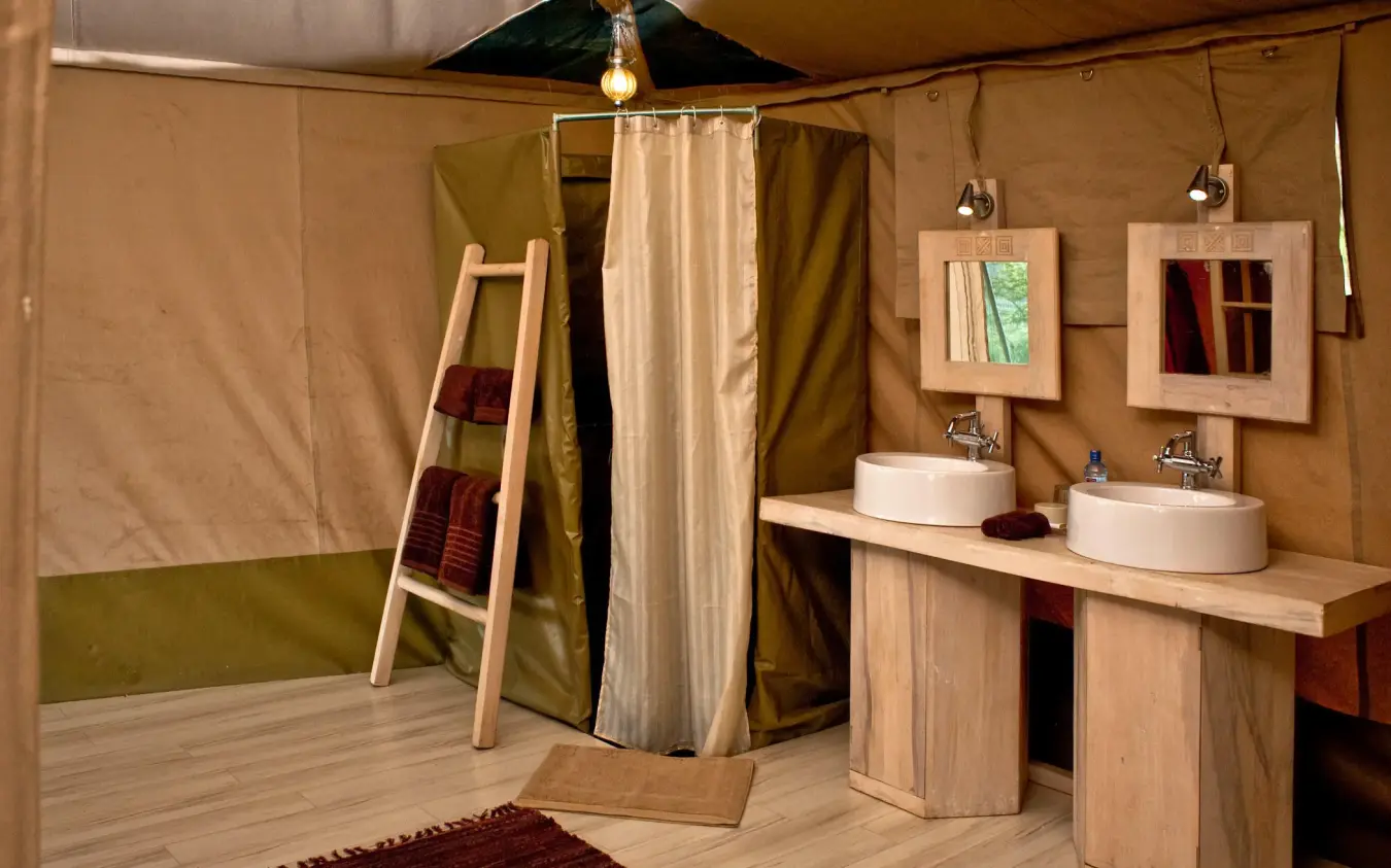 Luxury safari tent bathroom with dual sinks and shower, Kicheche Valley Naboisho, Maasai Mara, Kenya