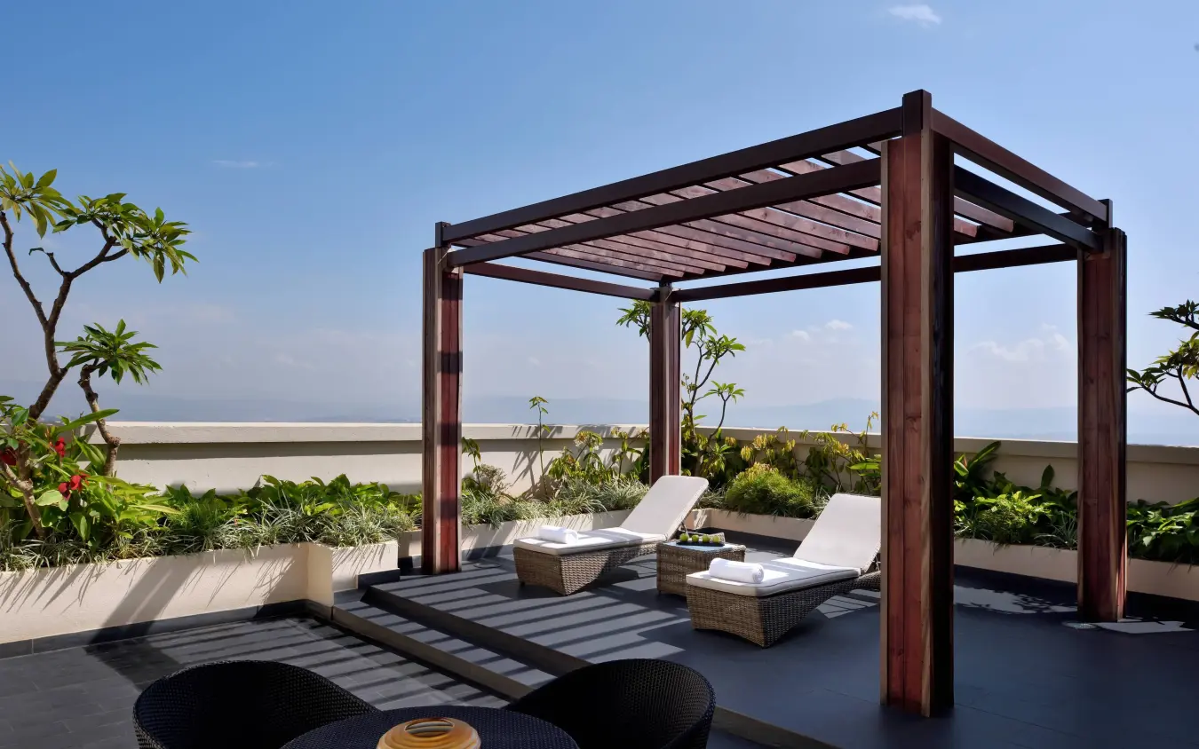 Rooftop terrace with loungers overlooking water and landscape, Kigali Marriott Hotel, Kigali, Rwanda