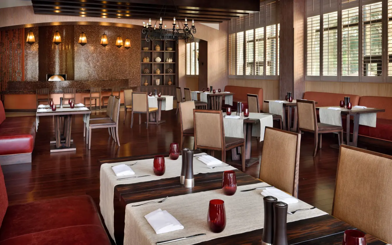 Elegant dining room with wooden tables and warm lighting, Kigali Marriott Hotel, Kigali, Rwanda