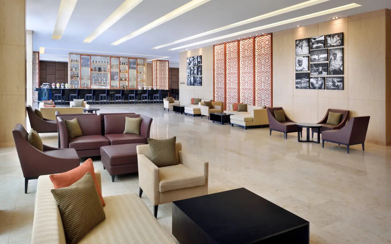 Modern hotel lobby with seating areas and geometric wall art, Kigali Marriott Hotel, Kigali, Rwanda