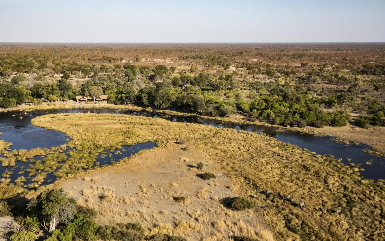 Aerial view of river bend with wildlife waterhole and savanna, King’s Pool, Linyanti Wildlife Reserve, Botswana