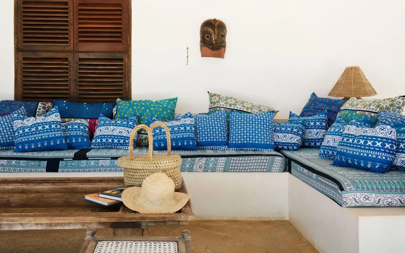Blue patterned cushions and traditional woven accessories on built-in seating, Kinondo Kwetu, Diani Beach, Kenya