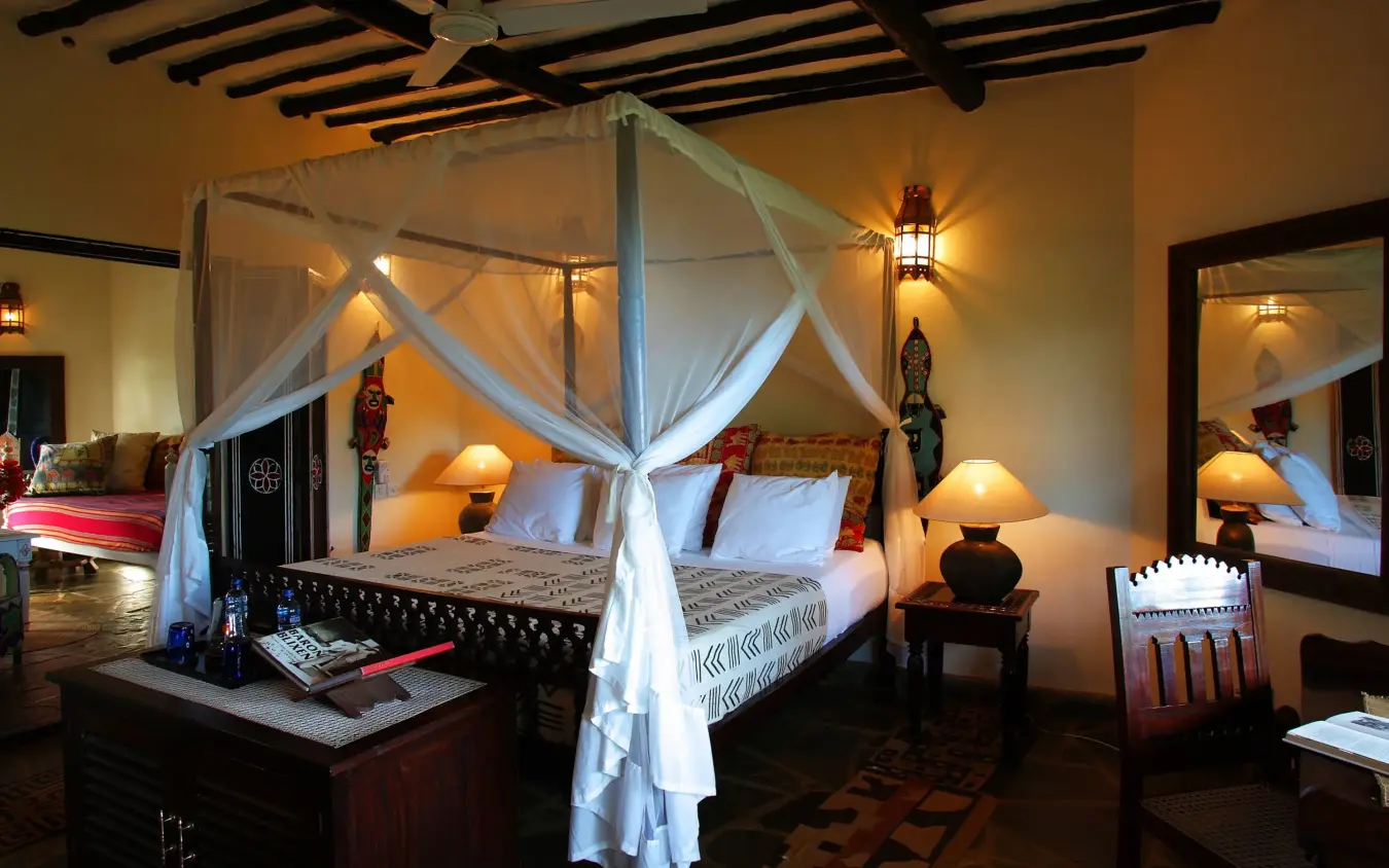 Luxury bedroom with four-poster canopy bed and ambient lighting, Kinondo Kwetu, Diani Beach, Kenya