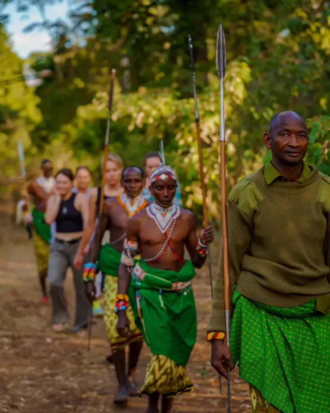 Guided walking tour with armed Maasai warriors in forest, Northern Kenya, Kenya