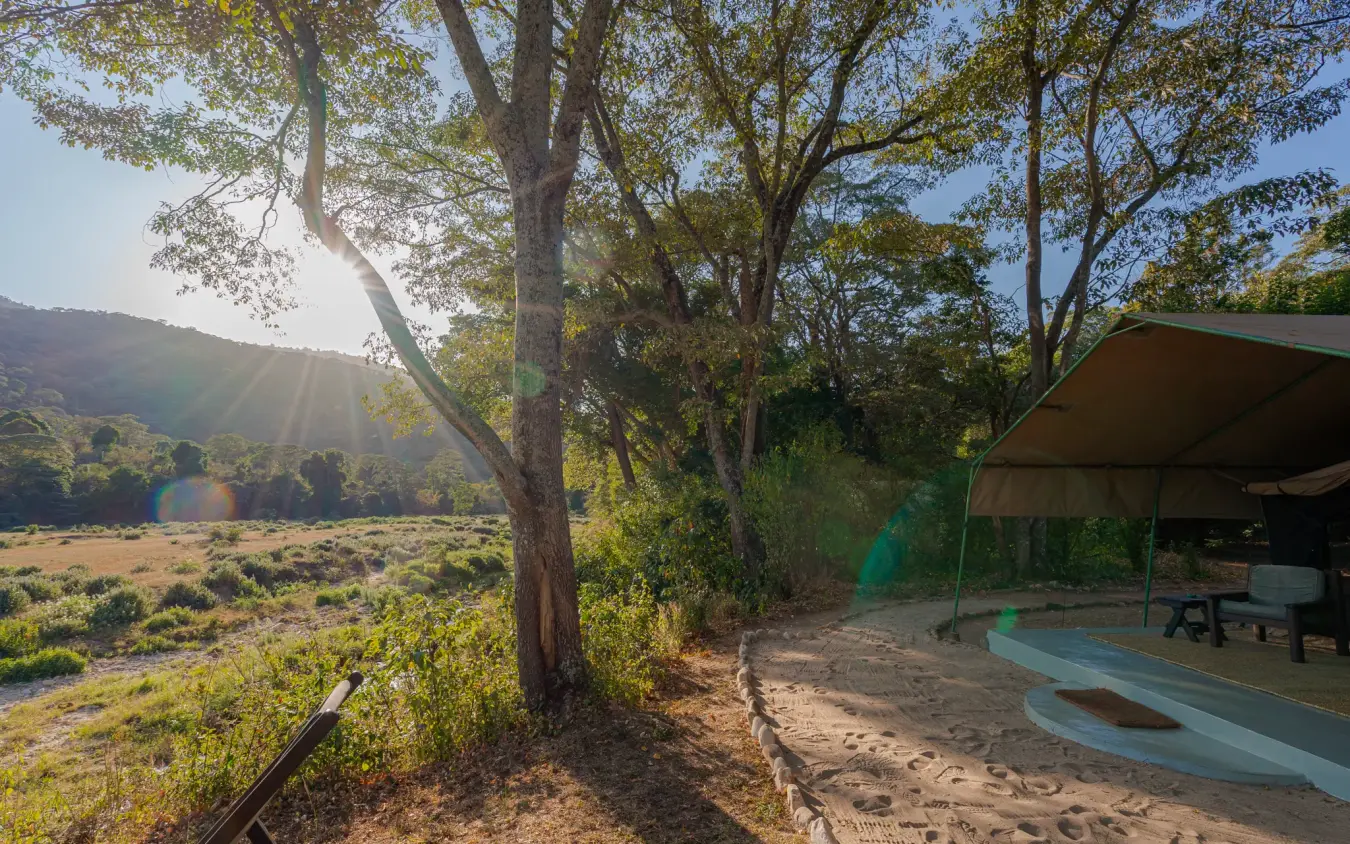 Sandy deck with shade structure overlooking river valley, Kitich Camp, Northern Kenya, Kenya