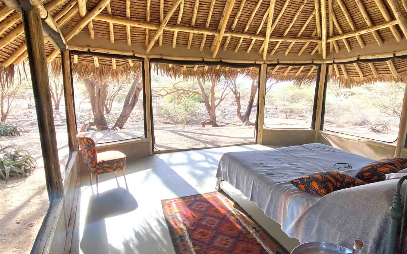 Open-air bedroom with thatched roof and natural light, Koros Camp, Northern Kenya, Kenya