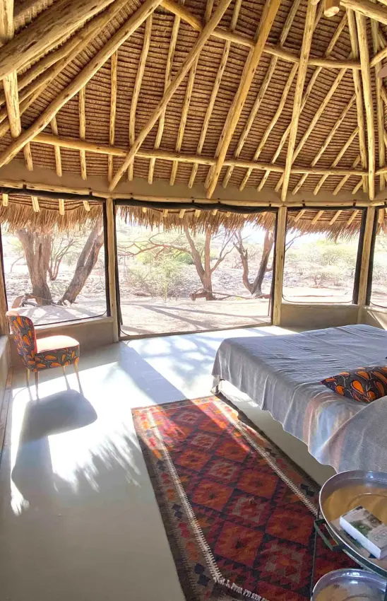 Open-air bedroom with thatched roof and natural light, Koros Camp, Northern Kenya, Kenya