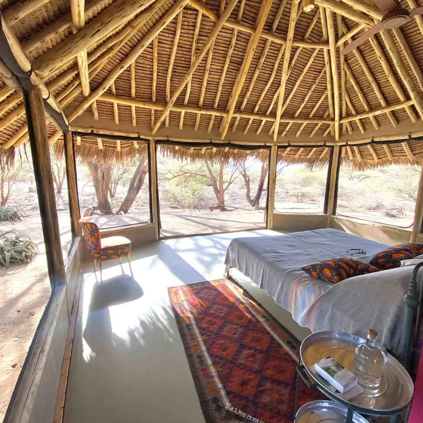 Open-air bedroom with thatched roof and natural light, Koros Camp, Northern Kenya, Kenya