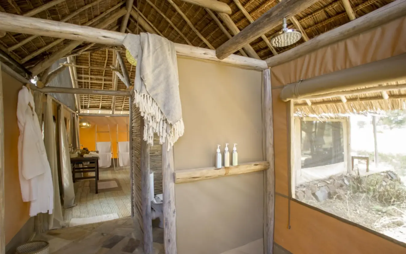 Open-air bathroom with thatched roof and natural materials, Kuro Tarangire, Tarangire National Park, Tanzania