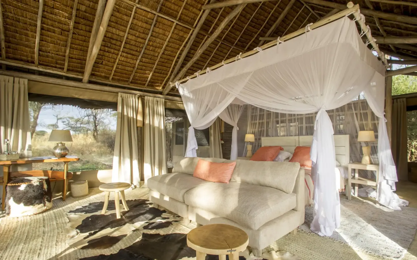 Luxury bedroom suite with canopy bed and open-air design, Kuro Tarangire, Tarangire National Park, Tanzania