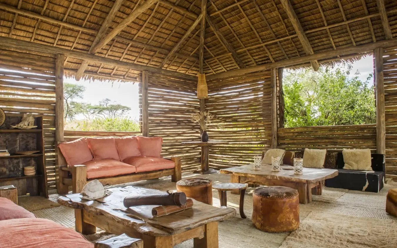 Open-sided lounge pavilion with thatched roof and seating, Kuro Tarangire, Tarangire National Park, Tanzania