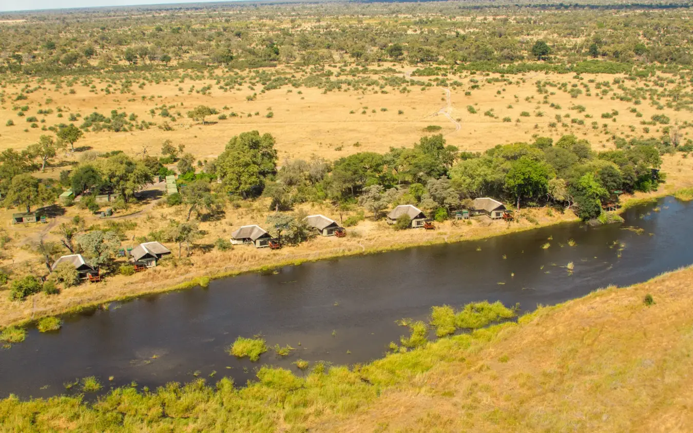 Luxury safari camp along riverbank in savanna landscape, Kwando Lagoon Camp, Linyanti Wildlife Reserve, Botswana