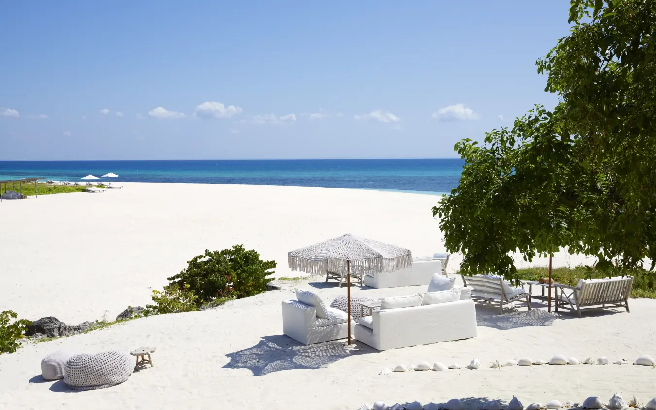 Private beach lounge with white furniture and ocean view at sunset, Laba Fanjove, Zanzibar & Pemba, Tanzania