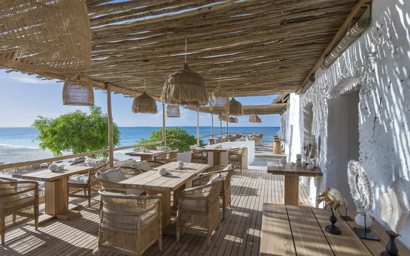 Beachfront dining pavilion with woven shade structures overlooking ocean, Laba Fanjove, Zanzibar & Pemba, Tanzania