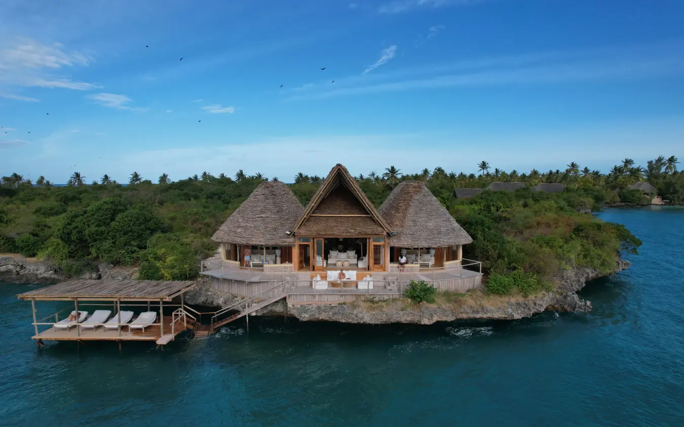 Overwater bungalow with thatched roof on tropical island lagoon, Laba Fanjove, Zanzibar & Pemba, Tanzania
