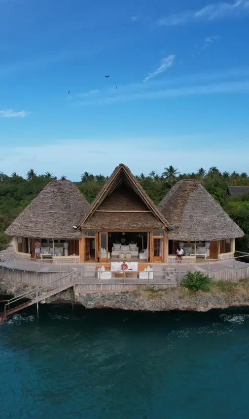 Overwater bungalow with thatched roof on tropical island lagoon, Laba Fanjove, Zanzibar & Pemba, Tanzania