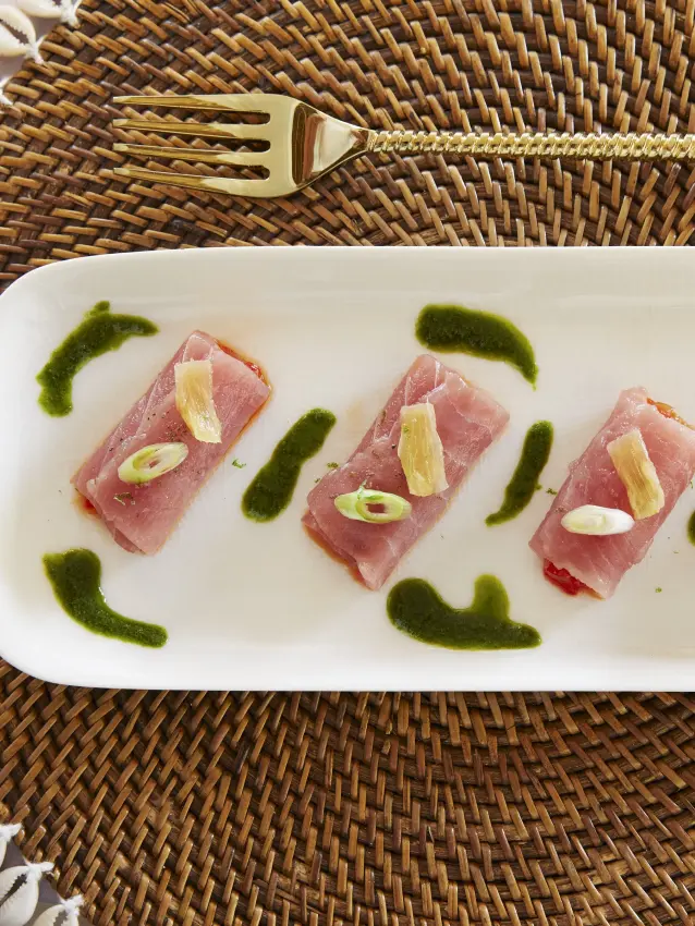 Plated cured meat appetizer with herb garnish and decorative fork, Laba Fanjove, Zanzibar & Pemba, Tanzania