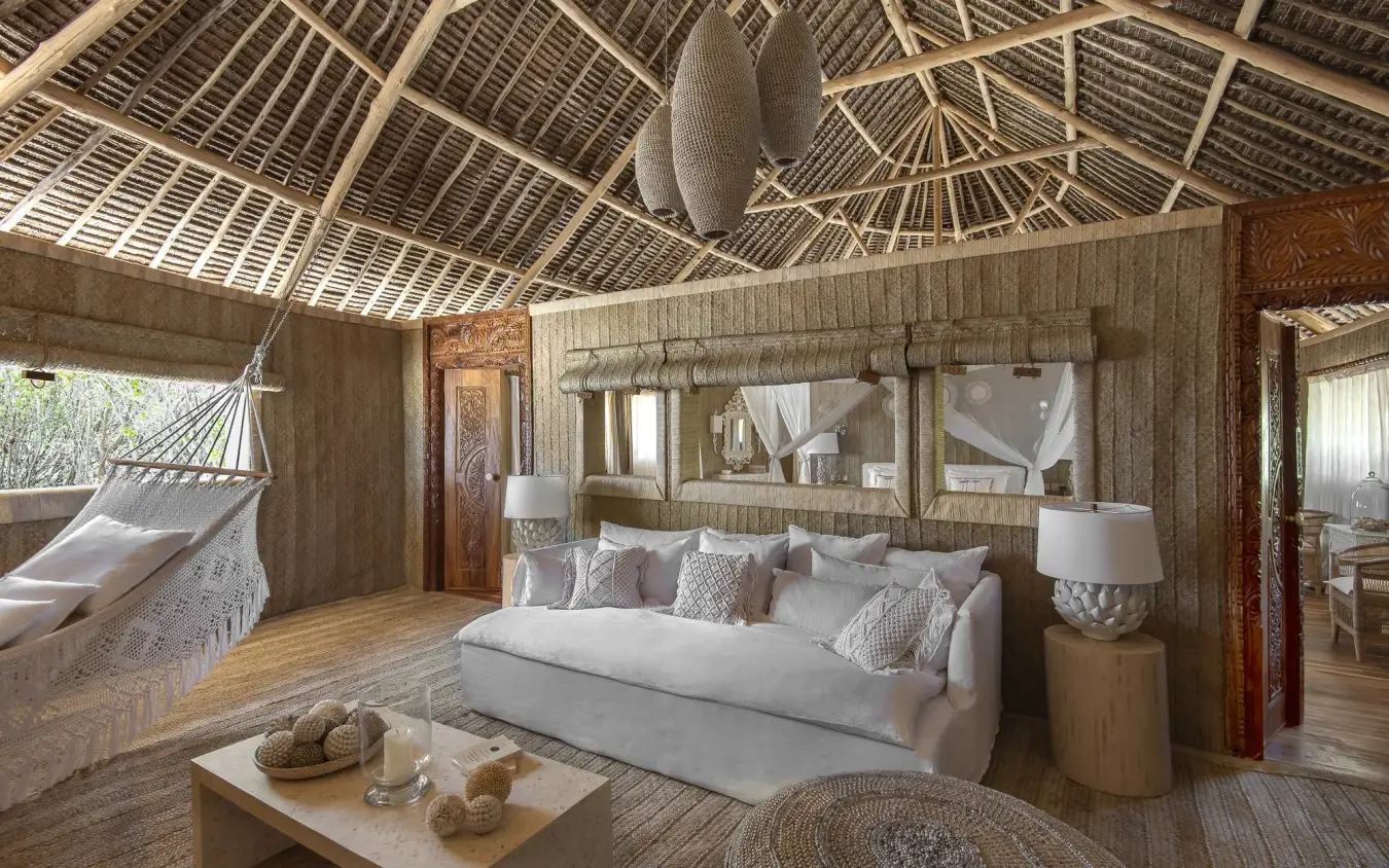 Luxury safari bedroom with wooden walls and thatched ceiling details, Laba Fanjove, Zanzibar & Pemba, Tanzania