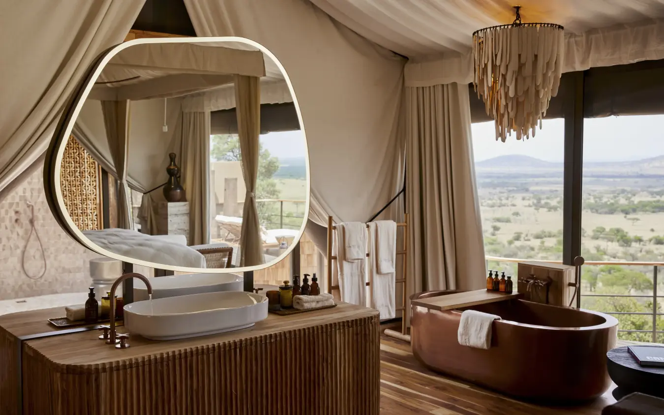 Luxury safari lodge bathroom with copper tub and valley views, Laba Grumeti Art Lodge, Serengeti National Park, Tanzania