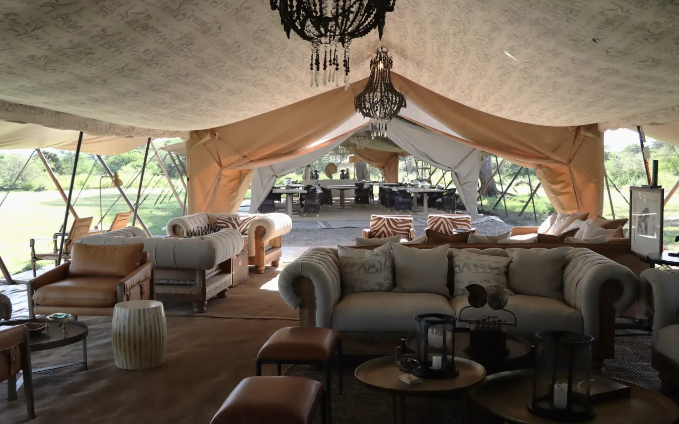 Luxury safari lodge interior with canvas tent, draped fabrics and elegant furnishings, Laba Migration Camp, Serengeti National Park, Tanzania