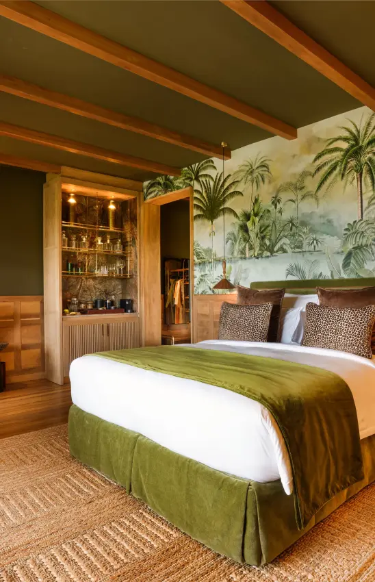Luxury bedroom with tropical wallpaper and wooden beam ceiling, Laba Ngorongoro Lodge, Ngorongoro Crater, Tanzania