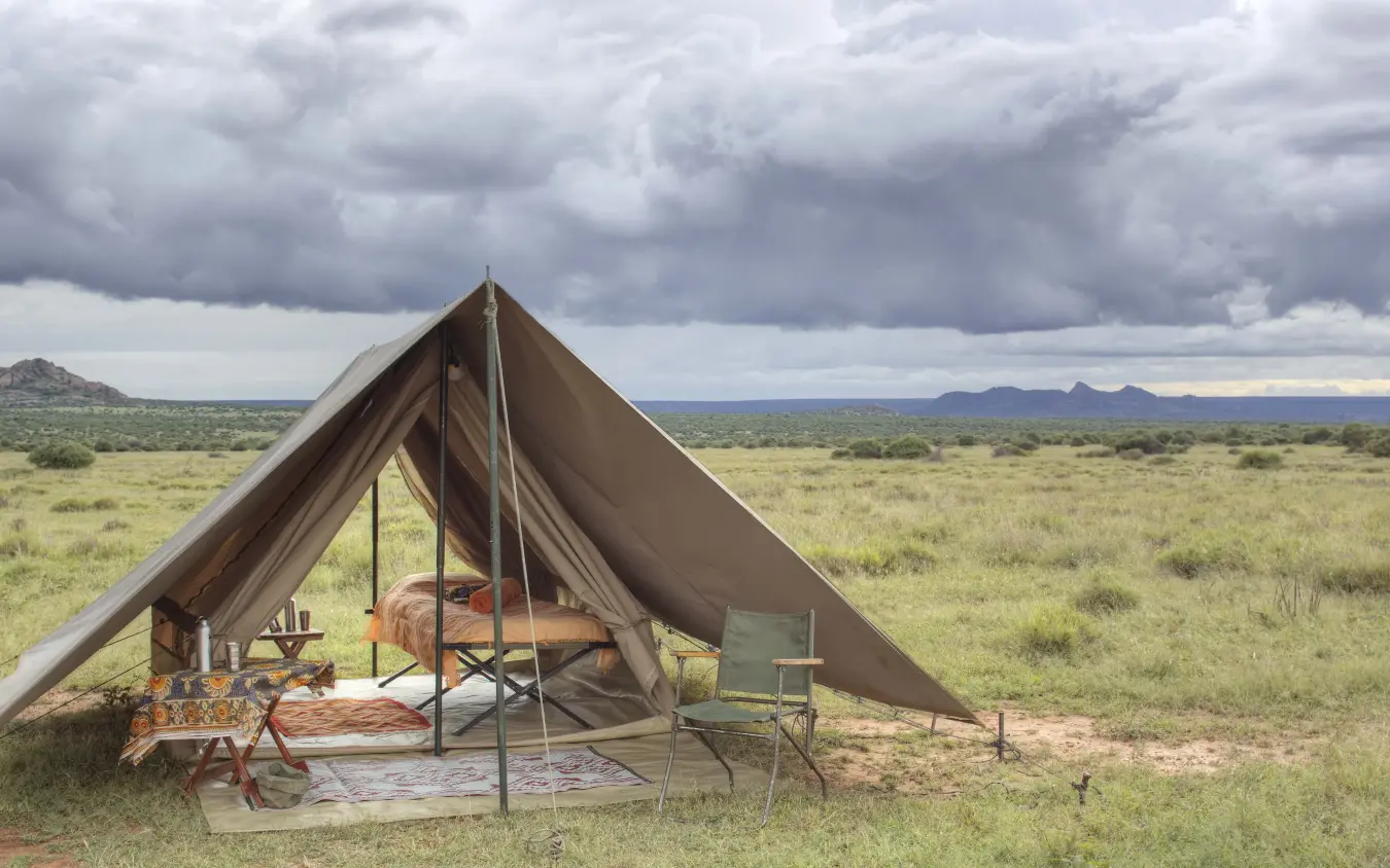 Canvas tent camp setup in open savanna landscape, Karisia Walking Safaris, Laikipia Highlands, Kenya