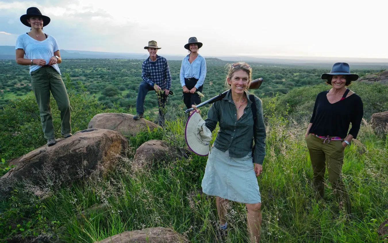Guide and guests conducting wildlife survey with equipment, Karisia Walking Safaris, Laikipia Highlands, Kenya