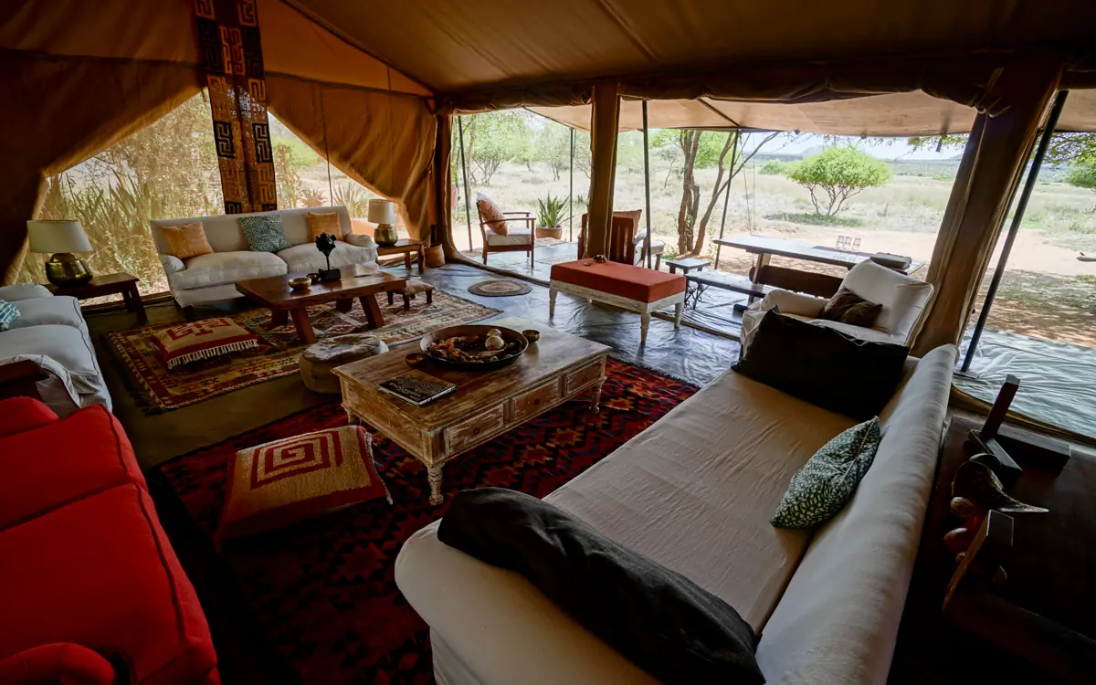 Spacious canvas tent lounge with comfortable seating and views, Karisia Walking Safaris, Laikipia Highlands, Kenya